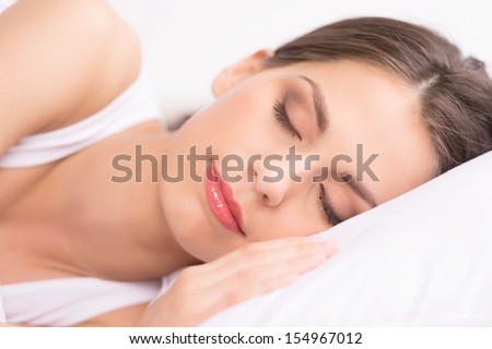 Woman sleeping. Close-up of beautiful young woman sleeping on the sofa
