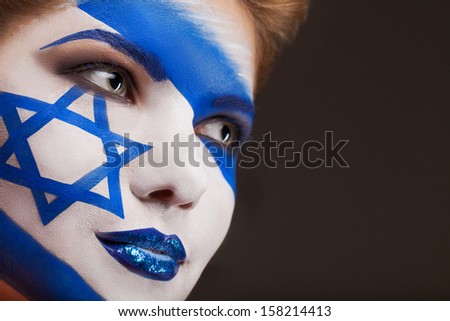 Girl with Face art. Israel flag painted on a face.