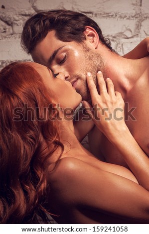 Beautiful couple having sex. Kissing each other being nude