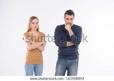 Scared woman staying near thoughtful sad man. Idea of uncontrolled rude behavior