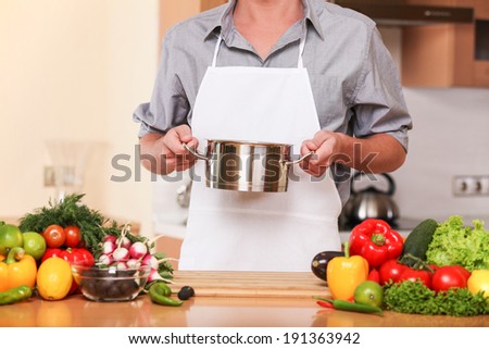 Man cooking. Male chef cooking in the kitchen