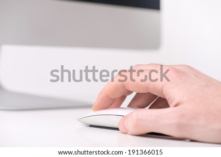 Computer user. Male hand holding computer mouse
