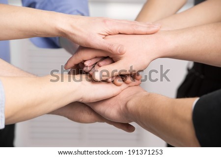 Close-up of hands stacked. Business team joining hands
