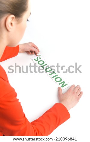 Woman placing last piece of Puzzle. Girl with puzzle Idea isolated on white background