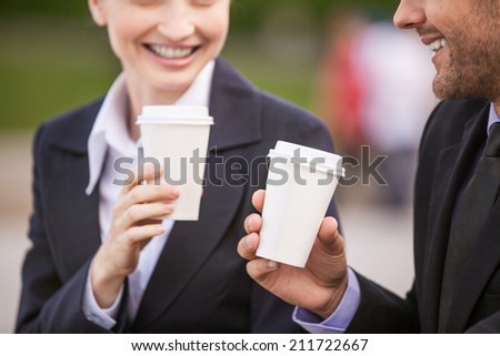 Business people drinking coffee outside. Business partners closeup while on stairs