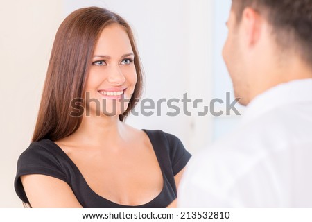 Closeup photo of romantic couple looking at each other. wife looking at husband before leaving to work