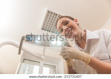 Happy female dentist doctor smiling in camera. Happy female dentist doctor smiling in camera