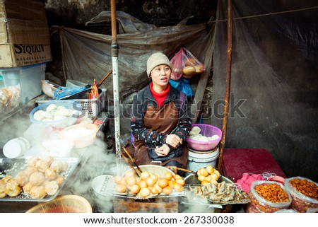 Sapa, Lao Cai, Vietnam - 6 May 2014: Vietnamese woman selling food on the local market, Sapa, Northern Vietnam on 06 May 2014.