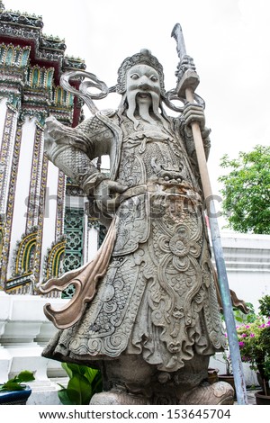 Chinese warrior statue in the Wat Pho, Bangkok, Thailand