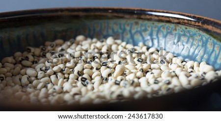 Pottery bowl with dried black eyed peas.