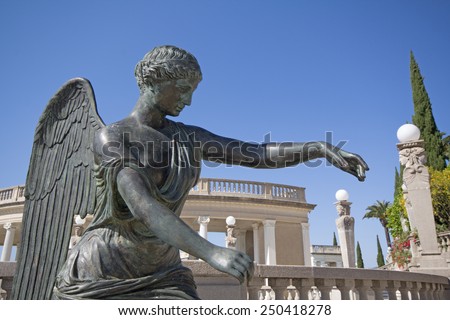 SAN SIMEON, CA, USA April 15, 2013 Hearst Castle grounds, bronze sculpture of an angel near the Neptune swimming pool.