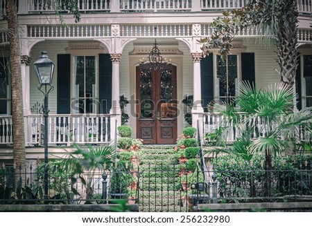 SAVANNAH, GA USA June 22, 2012 Gorgeous antebellum Savannah home with a traditional front porch.  Savannah is reported to be the most haunted city in the United States.