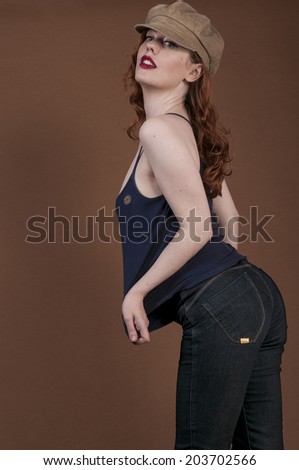 Woman seen from side wearing jeans