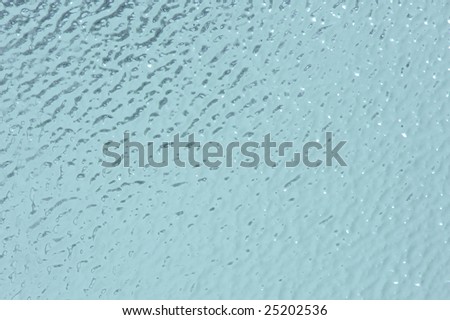 high resolution background of a blue rippled glass plate with cool texture. Ideal for many cool designs.