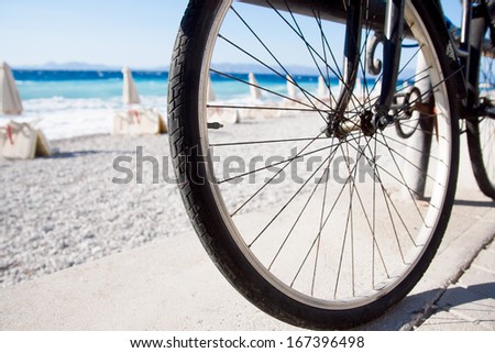 Close up on a bike wheel.Bike wheel at the seaside on the