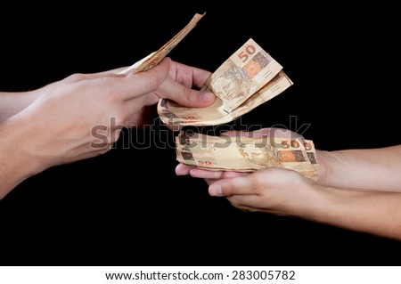 brazilian rich man paying someone with real cash