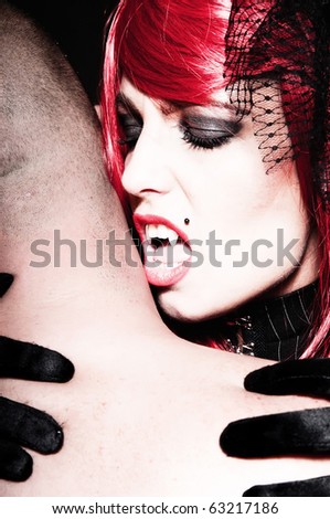 Sexy redhead vampire getting ready for a bite