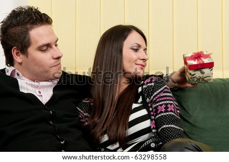 Man showing a gift to his girlfriend