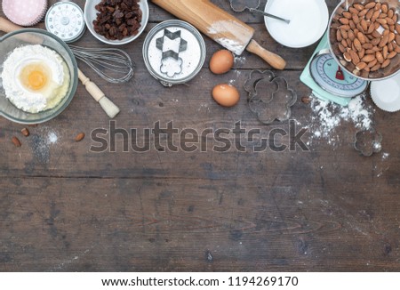 Home baking kitchen setting with ingredients for bread and cup cakes