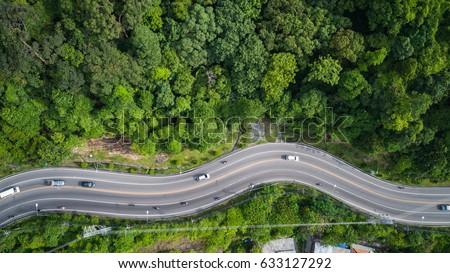 Top view car and road on the hill in Phuket, Thailand. Aerial view from flying drone.