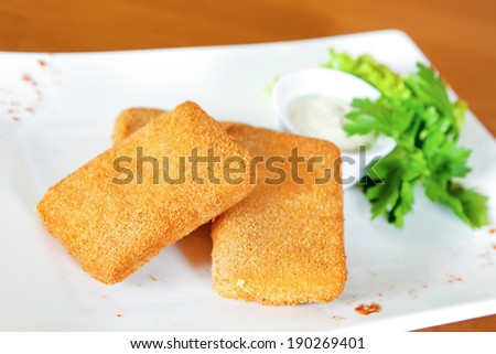 Deep-fried cheese with parsley and tartar sauce