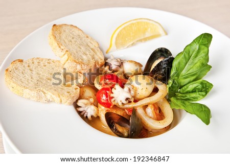 Fish soup with prawns, mussels, octopus, squids and deep-sea scallop