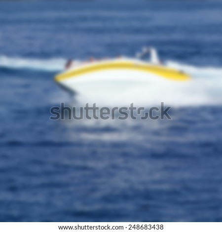 Abstract blurred image of fast motor boat as a background for your design