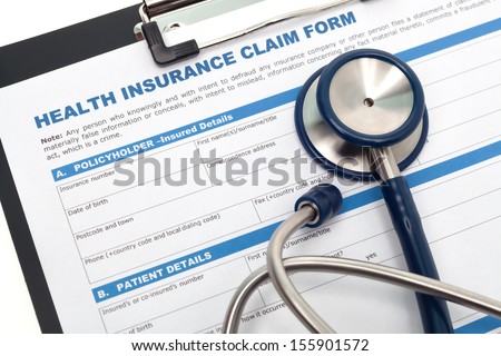 Medical and health insurance claim form with stethoscope on clipboard