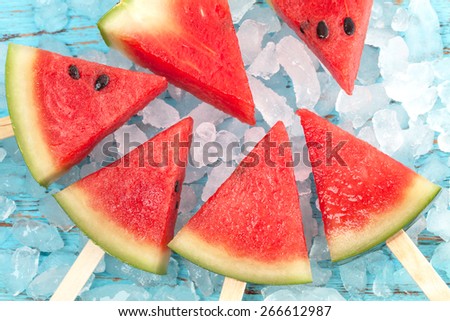 watermelon popsicle yummy fresh summer fruit sweet dessert on vintage old wood teak blue