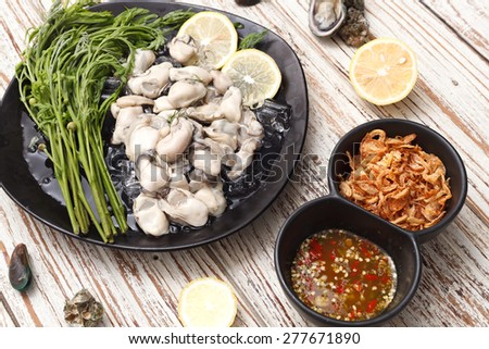 Oyster seafood lemon fresh asia  fried shallots sauce  mussel asia appetizer luxury