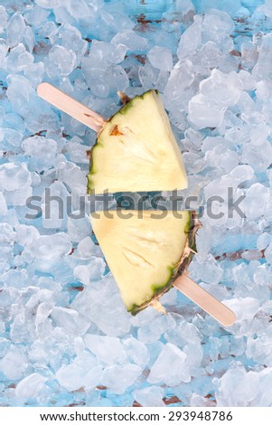 pineapple popsicle yummy fresh summer fruit sweet dessert on vintage old wood teak blue