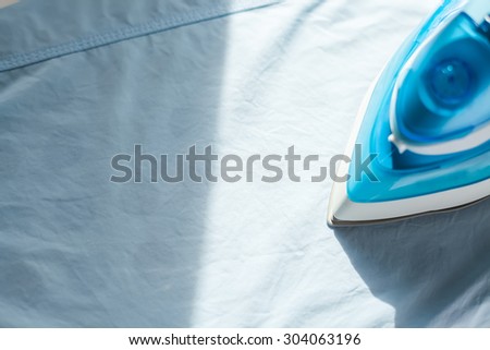 ironing housework ironed folded shirts clean concept still life garment apparel cloth indoors