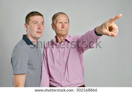 Father and son.Dad pointing at something