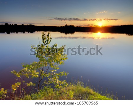 Summer sunset on a lake. Ruza reservoir in Russia.