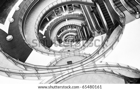 View down in a modern hall. Image looks like infinity twisted spiral.