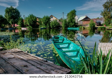 Wooden boat on a river bank near in Russian provincial town Pereslavl-Zalessky.