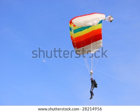 A colorful parachute in a blue sky on a sunny day