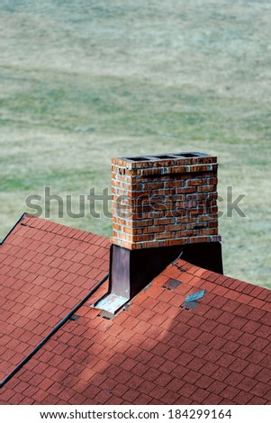 Roof with a chimney in beautiful light