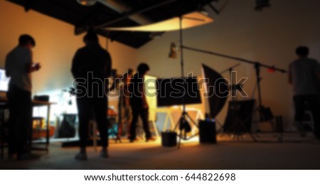 Blurred of production team shooting some video movie for tv commercial with studio equipment set.