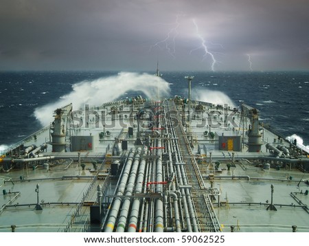 vlcc or oil tanker ship on open rough sea