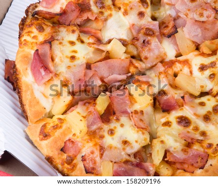 Tasty pizza in box on white