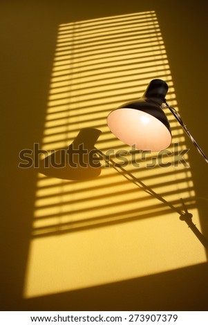 Contrasting still life: Vintage lamp on a writer\'s or journalist\'s desk in the office