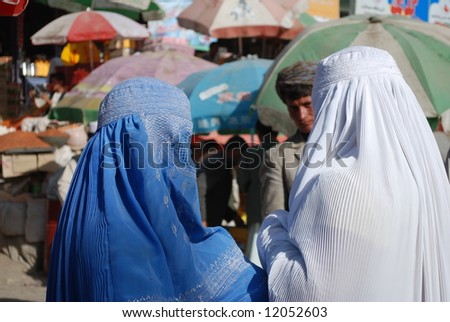 Afghan women in burka at bazaar