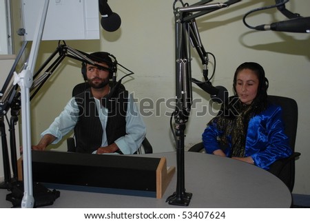 BAHARAK, AFGHANISTAN - AUGUST 12:Afghan woman radio broadcaster, from Baharak, Badakhshan, broadcasting in Baharak, northern Afghanistan. Community radio station.