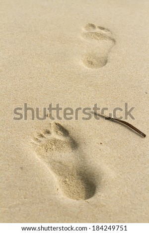 foot print on the sand of soft beach