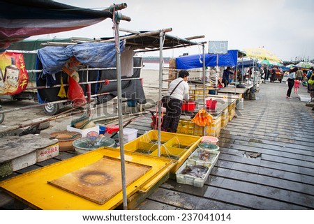 Wenchang, Hainan, China - January 17, 2014: The view in the fishing port, most of the seafood have been sold out