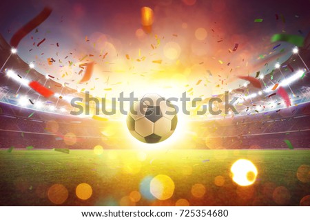 Floating soccer ball at the football stadium with smoke and bokeh abstract  \
background.