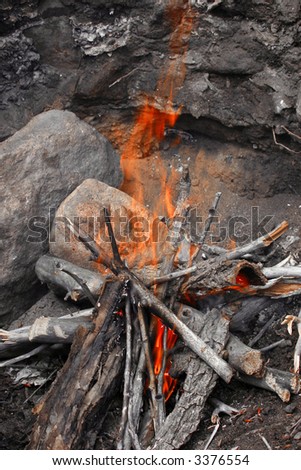 Small, hot campfire in well made stone circle is the safe way to create a fire pit in the wilderness