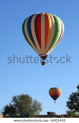 Hot Air Balloons fly over a residential area during the 2007 Albuquerque Balloon Fiesta
