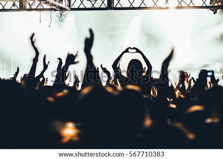 The crowd of fans at concerts. Hands fans.\
\
Russia, St. Petersburg